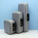 Three different sizes of a hard-shell privacy storage box in silver, showcasing the external security combination locks for adult toy protection.