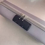 Close-up of a three-digit integrated security lock on a gray textured intimacy product organizer, ensuring private and safe storage.