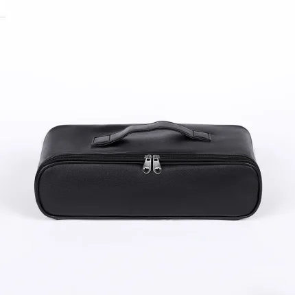 Front view of a black dual-zippered luxury storage case with heart-shaped zipper pulls and a reinforced top handle for easy carrying.