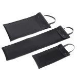 A set of three flat black leatherette pouches with snap-button closures and wrist loops, designed for organizing and protecting individual adult products.