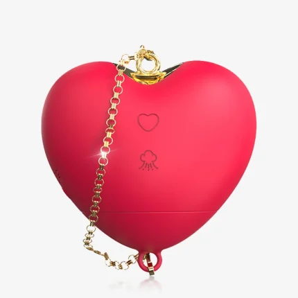 Main product shot of the LoveWave red heart-shaped suction vibrator with elegant gold chain accessory and dual-button control interface.