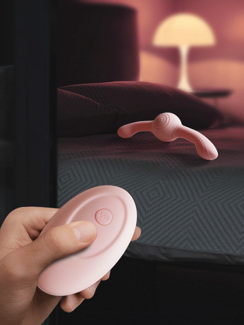 Discreet bedside scene featuring the Lumina Duet pleasure device and its ergonomic wireless remote control for convenient solo or partner play.