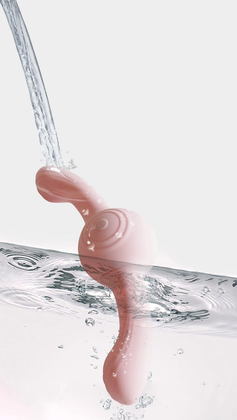 Waterproof adult toy being rinsed under a stream of water, showcasing its easy-to-clean design and IPX-rated moisture resistance.