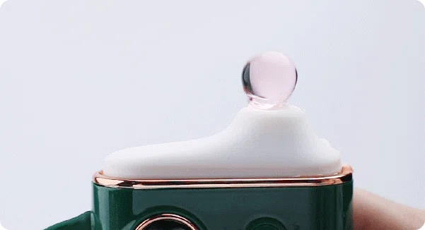 Close-up of a water droplet reacting to the high-frequency sonic waves emitted by the HH Luna Vault's clitoral suction head.