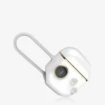 HH Luna Vault luxury white clitoral stimulator featuring a gold-trimmed interface, digital display, and integrated silicone finger loop for ergonomic control.