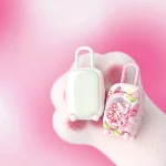 Hoohss Magic Suitcase discreet clitoral vibrator in a cute pink cat paw setting showing the artistic anime-style charging case.