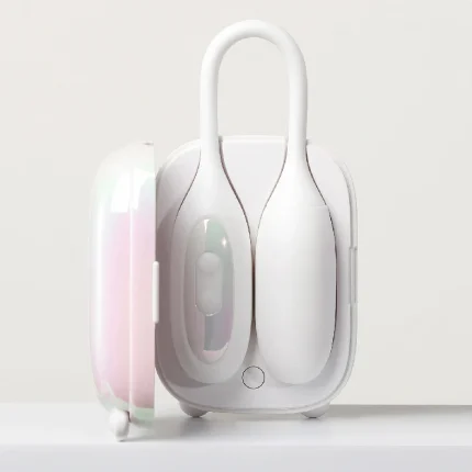 Front view of the iridescent HH Magic Suitcase charging station with the dual-function wearable vibrator ready for storage and rapid power-up.