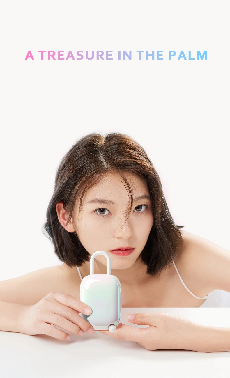 A lifestyle portrait of a woman holding the palm-sized Magic Suitcase, emphasizing its compact and portable design for travel.