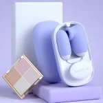 Lifestyle arrangement showing the compact and travel-friendly design of the wellness device alongside everyday personal care items.