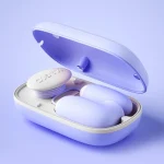 Side view of the open magnetic closure storage box revealing the sleek, nested placement of the waterproof massage wand and suction tool.