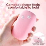 Ergonomic palm-sized remote control for the Magical Tongue massager showing the intuitive dual-button interface and textured grip.
