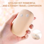 Lifestyle shot of the discreet, palm-sized travel vibrator held in hand to demonstrate its compact and portable design.