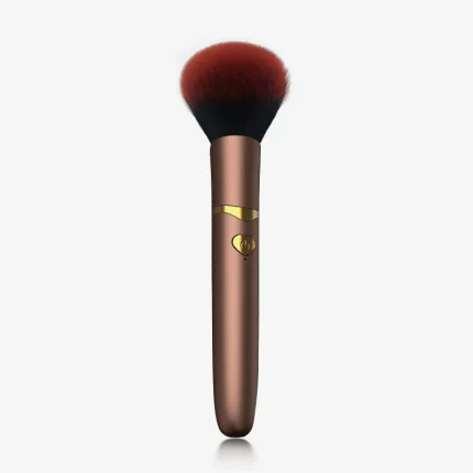 HH Makeup Brush Vibrator in champagne gold featuring a plush red synthetic fiber head for dual-purpose beauty and pleasure.