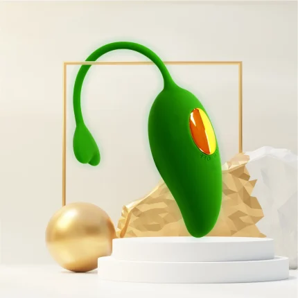 Premium lifestyle presentation of the green mango vibrator resting on a modern aesthetic pedestal for discreet bedside storage.