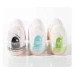 A six-piece set of male intimacy devices organized in a clear, travel-friendly egg carton style carrying case.