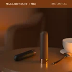 Maillard color themed MILY bullet vibrator on a bedside table with warm ambient lighting for a cozy and discreet aesthetic.
