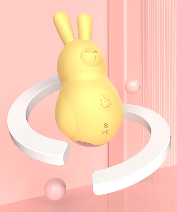 A yellow mini rabbit vibrator featuring a soft-touch silicone exterior and an easy-access power button for intuitive pleasure control.