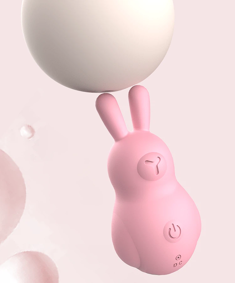Close-up of a pink clitoral stimulator highlighting the ergonomic bunny ear design for precise external massage.