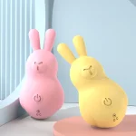 Pink and yellow handheld massagers standing upright to show the stable base and user-friendly interface for solo exploration.