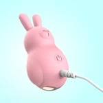 Detailed view of a rechargeable adult toy being powered via a DC cable, highlighting the convenient and eco-friendly battery system.