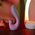 Back view of the Moon Bud massager highlighting the seamless silicone construction and international safety certification stamps.