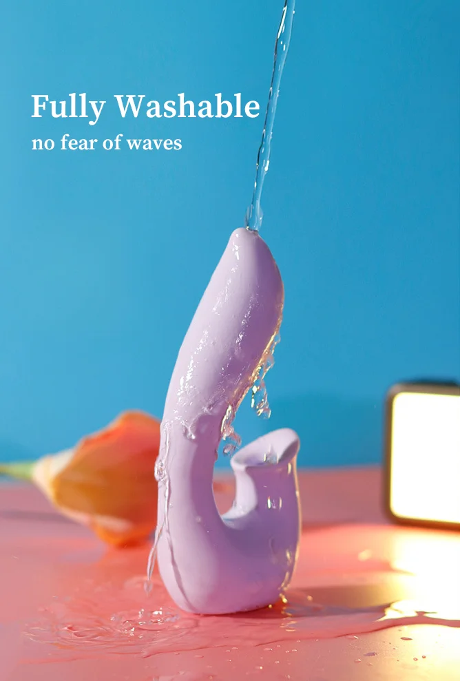 Waterproof adult product demonstration showing the fully washable medical-grade silicone body under running water.