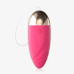 Close-up of the Murney pink pleasure tool emphasizing the textured spiral design and polished gold tip.