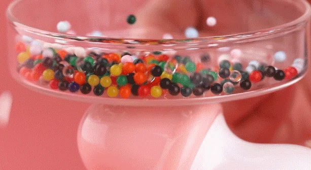 Demonstration of the high-frequency vibration power of this adult massager, showing its ability to move small objects through intense kinetic energy.