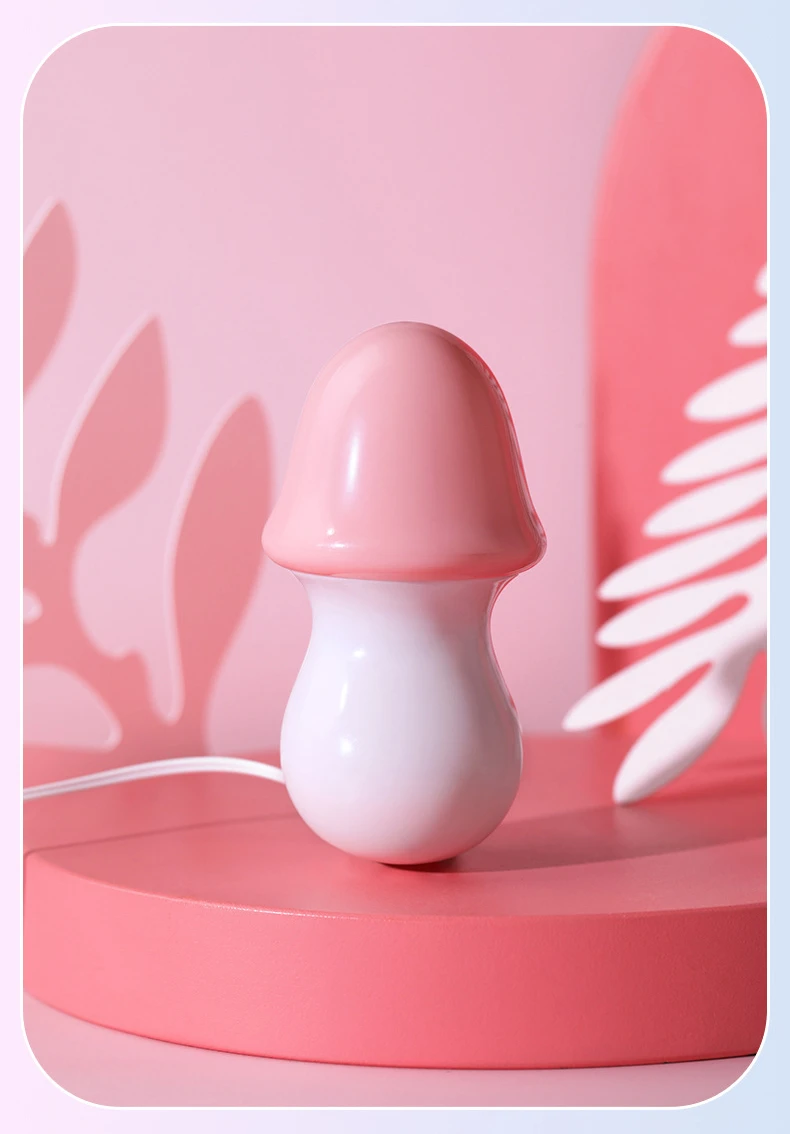 Front-facing studio shot of the pink mushroom head vibrator, showcasing its aesthetic pastel design and smooth finish.