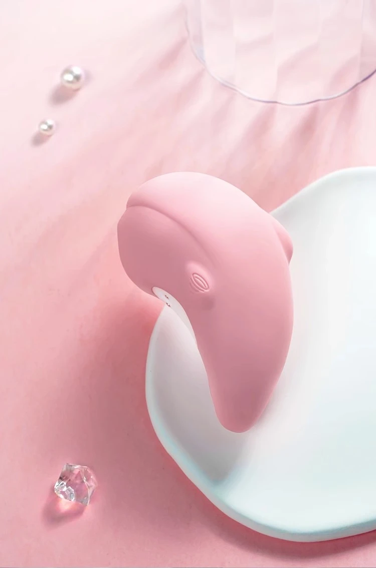 Soft-touch silicone vibrating massager in pastel pink, showcased in a lifestyle setting to emphasize its elegant aesthetic and smooth, body-safe texture.