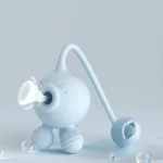 Mint green Octopulse pleasure device featuring a sonic suction nozzle and a flexible licking tongue attachment on a clean background.