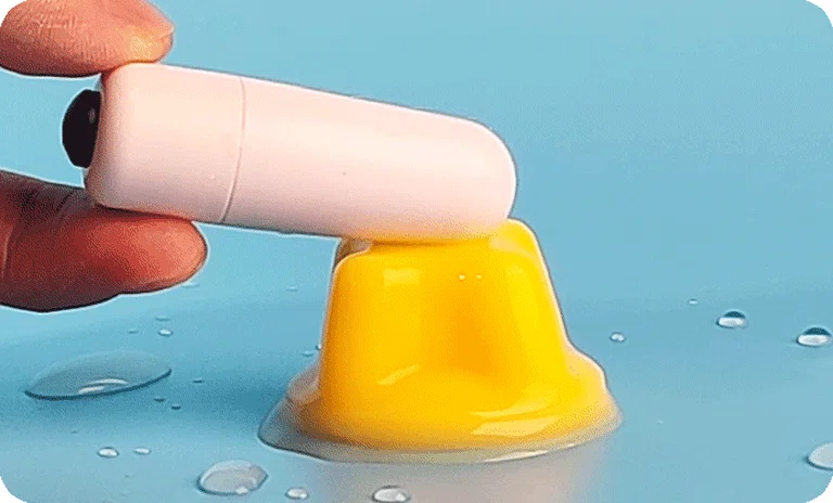A close-up demonstration of the powerful vibrations of this mini massage tool as it creates ripples against a soft, jelly-like surface.