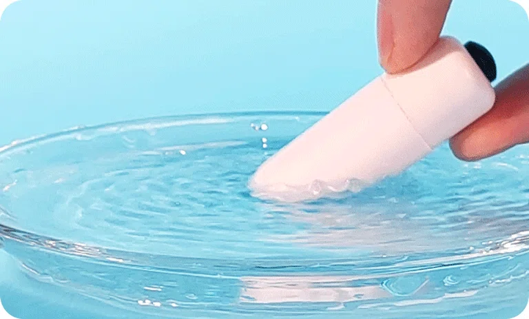 A visual representation of the intense vibration patterns of the Pearl Bullet stimulator against a water surface, highlighting its strong motor performance.