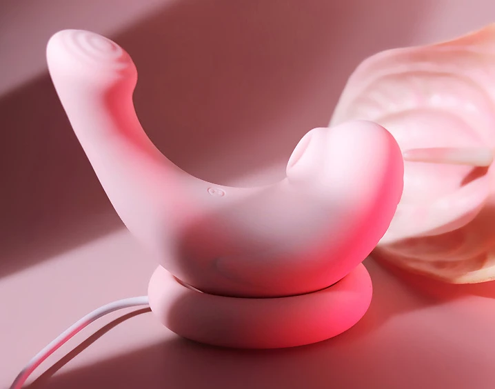 HH Pebble clitoral stimulator resting on its sleek magnetic charging base, showcasing the convenient wireless power solution for adult toys.