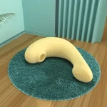 Overhead view of the HH Pebble pleasure wand resting on a textured mat, showcasing its flexible body and seamless, one-piece hygienic design.