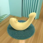 Yellow ergonomic dual-stimulation intimacy device displayed in a modern lifestyle setting to highlight its aesthetic and discreet design.