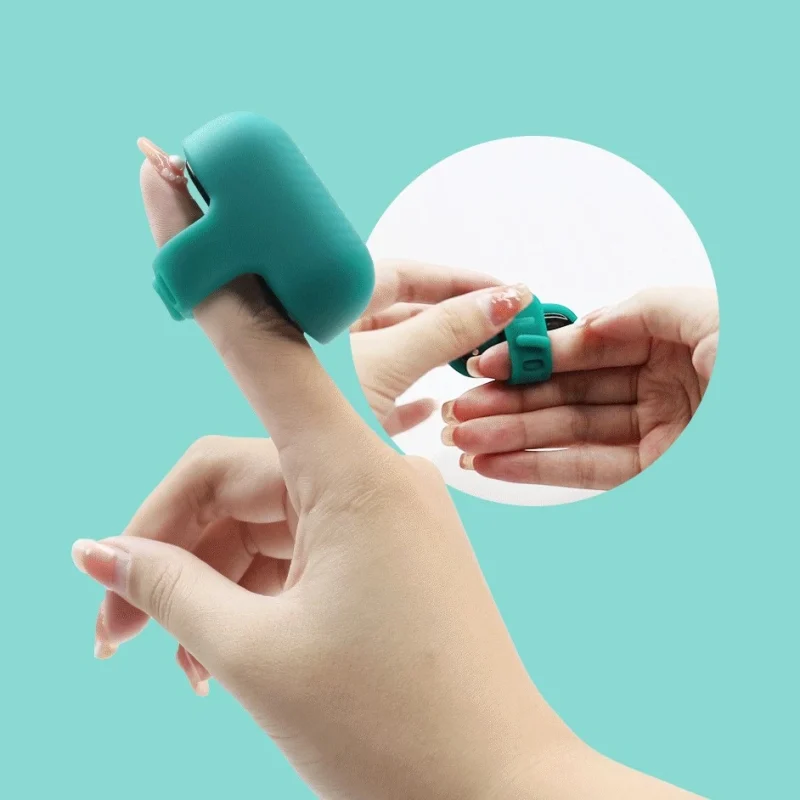 Close-up of a wearable finger vibrator with an adjustable pin-buckle silicone strap for a secure and customized fit during intimate play.