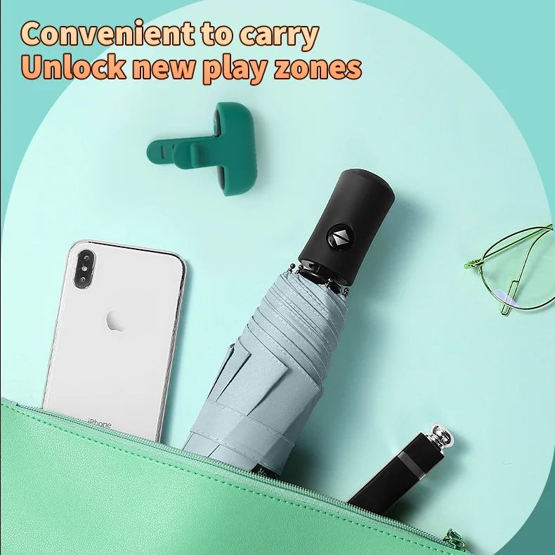 Lifestyle shot of a compact and discreet pleasure tool placed inside a handbag alongside everyday items like a smartphone and lipstick.