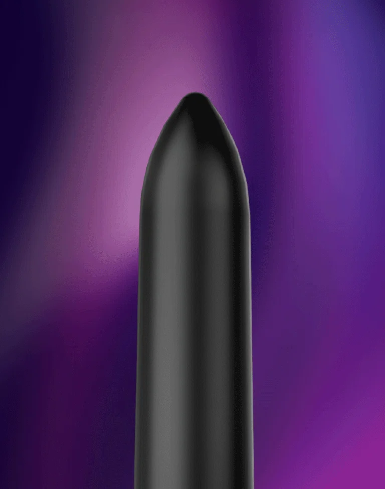 Minimalist black finger massager with a smooth matte texture set against a vibrant purple and blue ambient background.