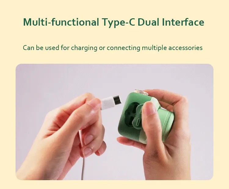 Close-up of the dual Type-C interface being used to connect a charging cable and external massage attachments to the main power unit.