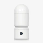 Minimalist front-facing studio shot of a white rechargeable male stroker featuring a single-button control interface.