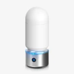 Sleek silver and white HH Spirit Bomb desktop-style male vibrator featuring a discreet design and LED power indicator.