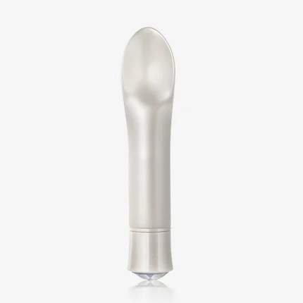 Aura Tip pearl white clitoral vibrator with a crystal-accented base and ergonomic flickering tip for targeted stimulation.
