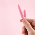 A side-by-side comparison of the two different stimulation tips included with the fingertip device, highlighting the precision-engineered shapes for targeted arousal.