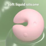 Detail shot of the high-quality soft liquid silicone texture on a curved pink body-safe intimacy tool.