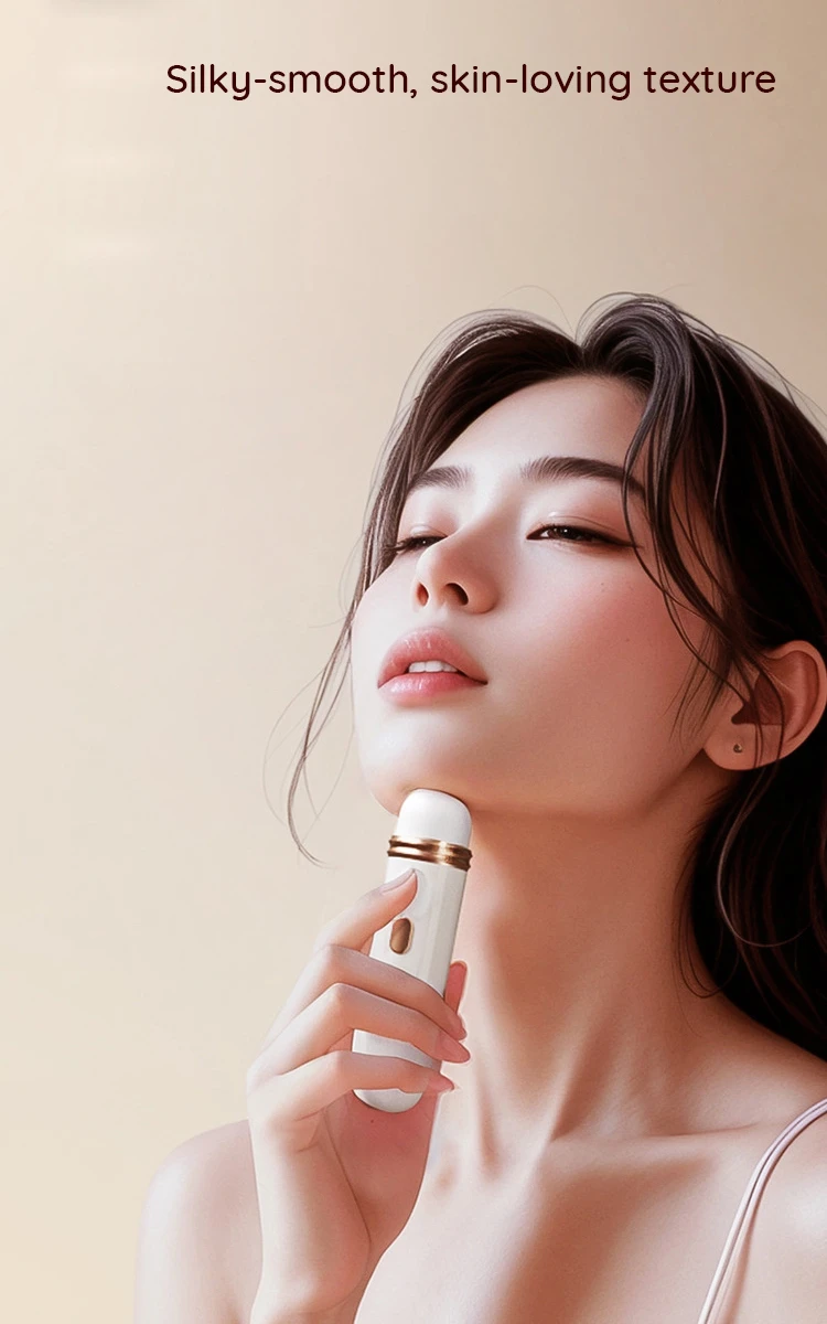 High-end beauty shot demonstrating the silky-smooth, skin-safe silicone texture of the handheld massager against the skin.