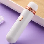 Close-up shot of the WhisperWave pleasure device featuring a sleek ergonomic handle and a single-button rose gold interface for intuitive control.