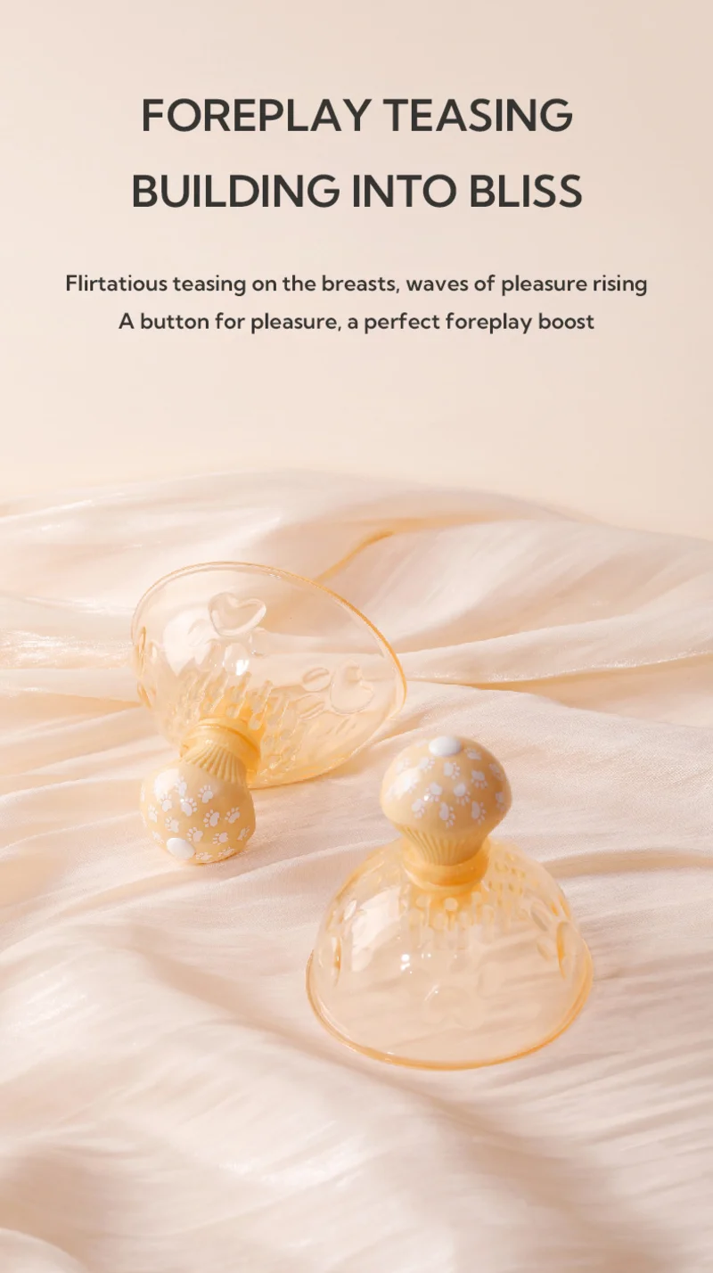 Foreplay-focused cat paw nipple massager on soft fabric with elegant translucent dome and sensual bedside styling