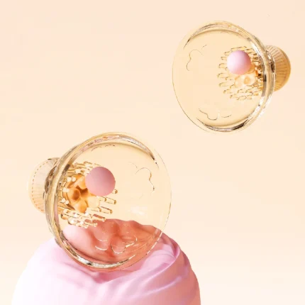 Transparent orange cat paw nipple massager set with domed cups and soft inner silicone spikes