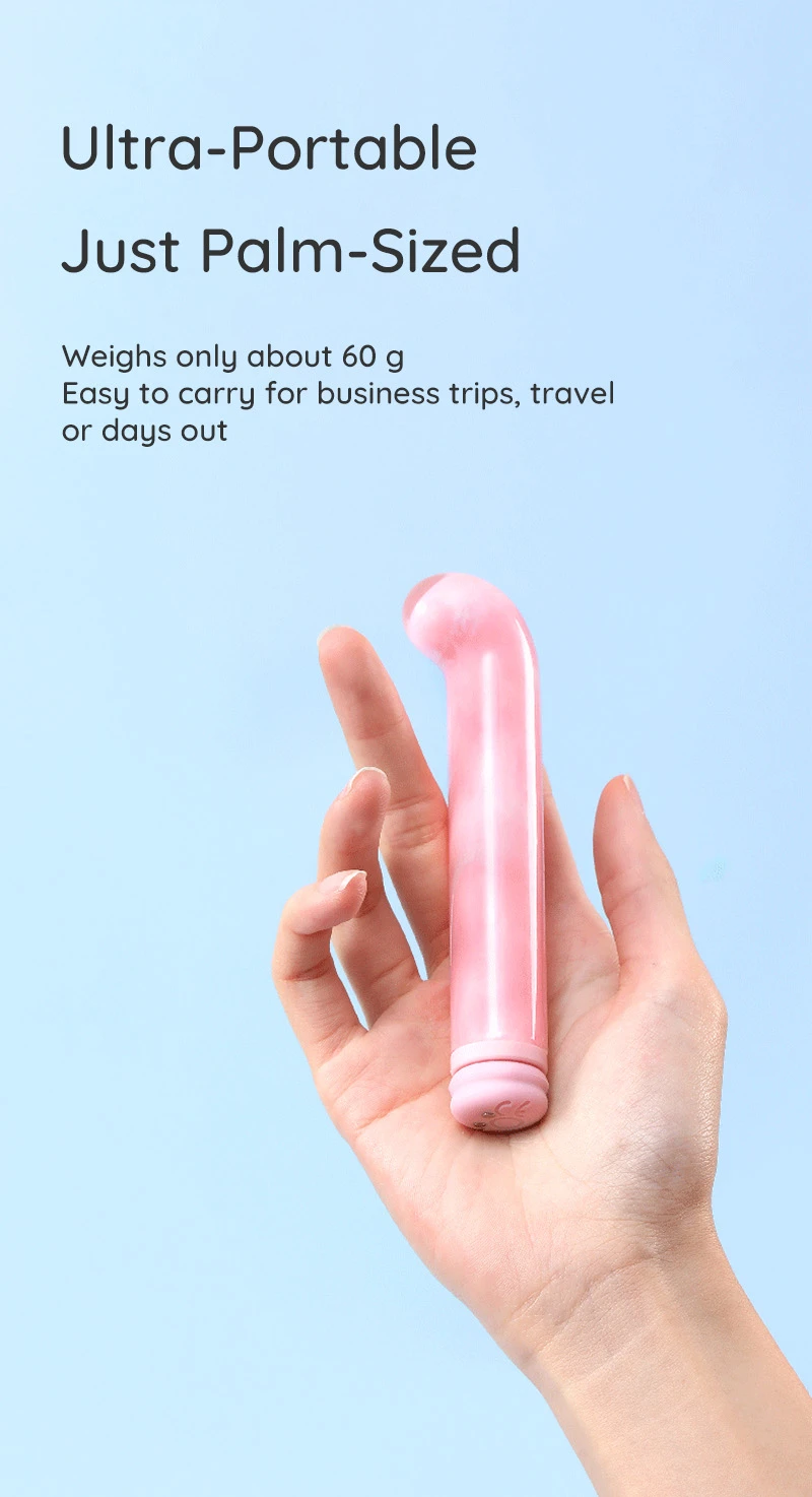 Palm-sized curved pink vibrator shown in hand for size reference